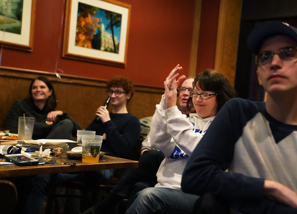 Jennifer Roberts, center, claps after Pete Buttigieg speaks